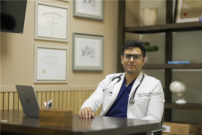 Dr. Essam Rashad in his consultation office, dual board-certified physician in Internal Medicine and Obesity Medicine